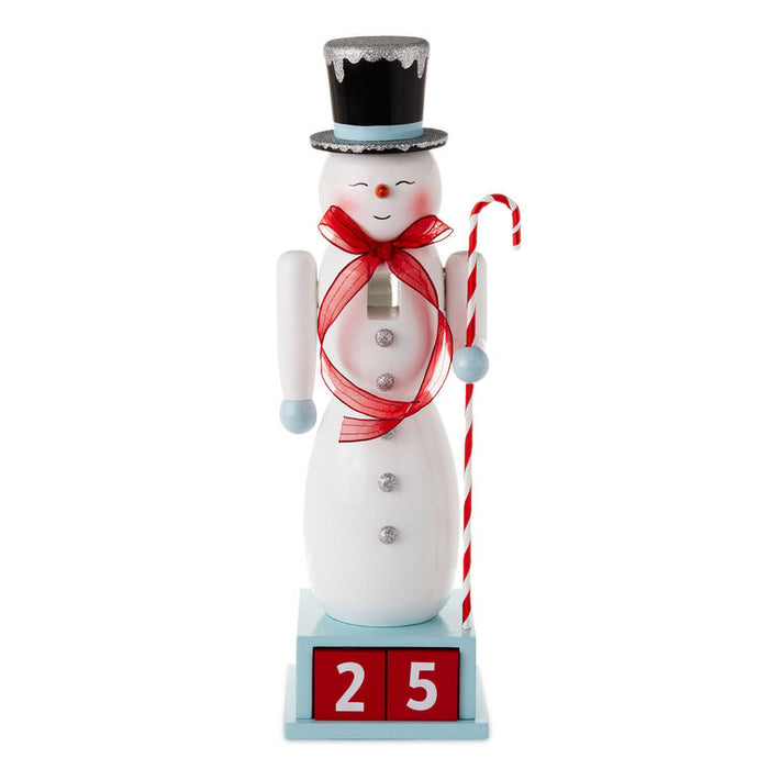 Decorative snowman figurine with a top hat, red scarf, and candy cane on a white background
