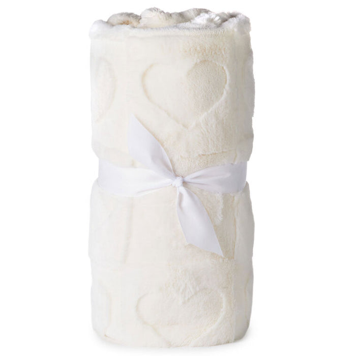 White textured blanket with a white ribbon on a white background