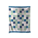 Patchwork quilt with blue, green, and white squares on a white background