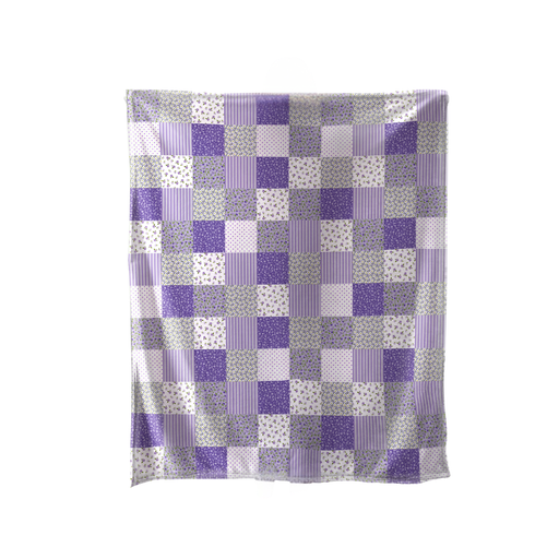 Patchwork blanket with purple and gray squares on a white background