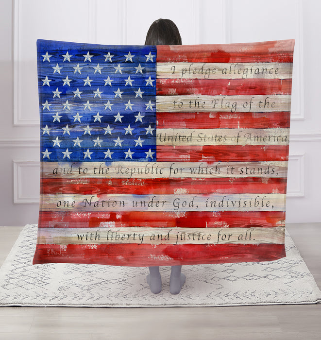 Person holding a large American flag with text against a white background