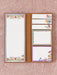 Set of stationery items with floral designs on a textured pink background