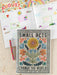 Calendar with floral design and motivational quote, surrounded by colorful planner pages.