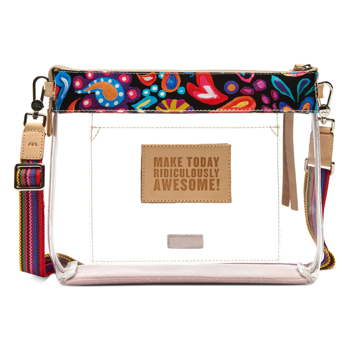 A clear plastic crossbody bag with a colorful paisley patterned top trim, a multicolor woven strap, and a tan leather patch on the front that reads 'MAKE TODAY RIDICULOUSLY AWESOME!'.