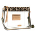 A clear plastic crossbody bag with a leopard print top band, beige leather-like brand patch on the front, and a multicolor woven strap, shown on a white background.