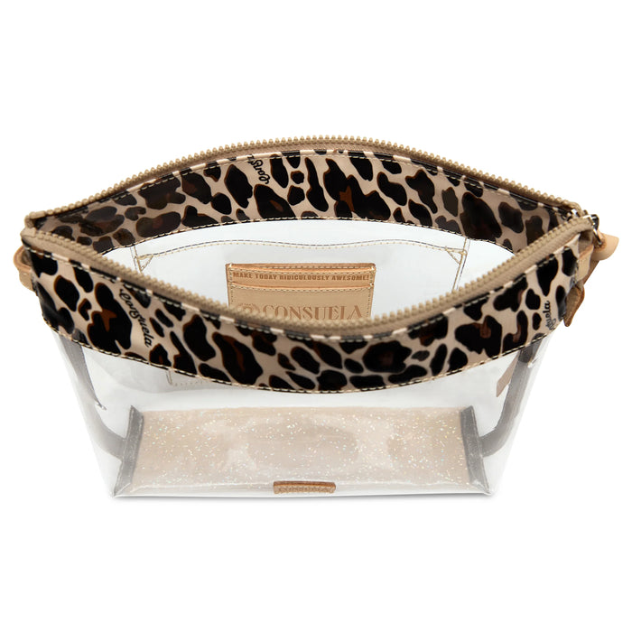 A clear plastic cosmetic pouch with a leopard print fabric zipper band and a glittery beige interior, shown on a white background.
