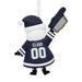 A personalized Christmas ornament shaped like a Santa Claus figure wearing a Dallas Cowboys football jersey and pointing a foam finger. The jersey has 'CLAUS' and '00' printed on it.