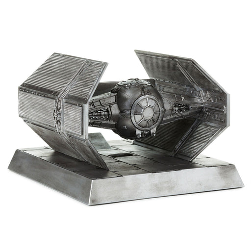 Metallic model of a spaceship on a white background