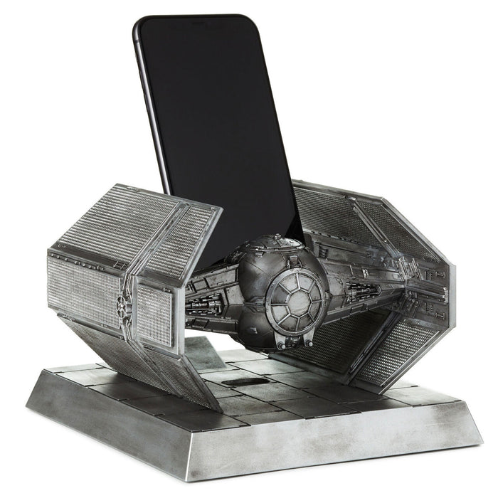 Phone stand designed like a Tie Fighter from Star Wars on a white background