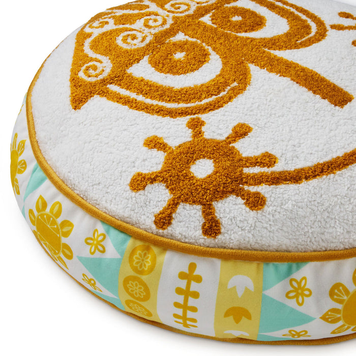 Round cushion with sun and flower pattern on a white background