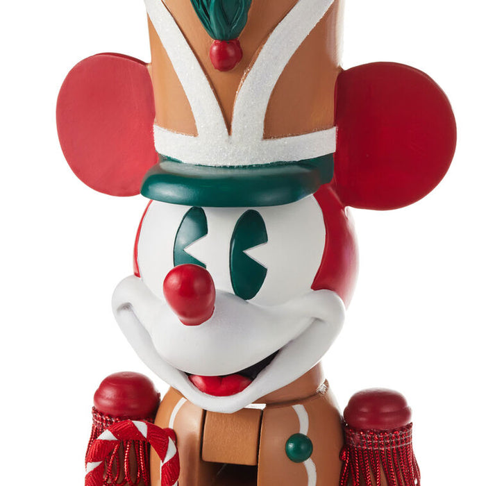 Decorative nutcracker with a clown face on a white background