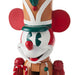 Decorative nutcracker with a clown face on a white background