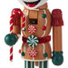 Decorative gingerbread man figurine with candy-themed design on a white background