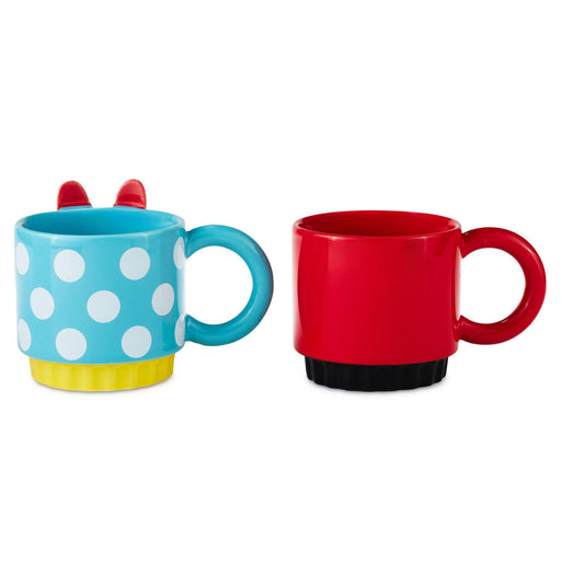 Two colorful mugs, one with polka dot design and the other red, on a white background.