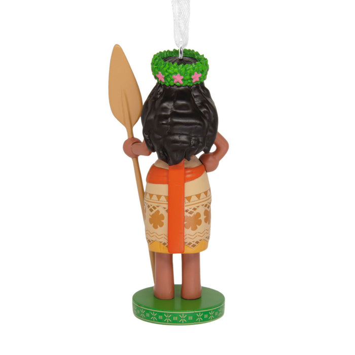 Decorative ornament of a person in traditional attire with a paddle on a white background