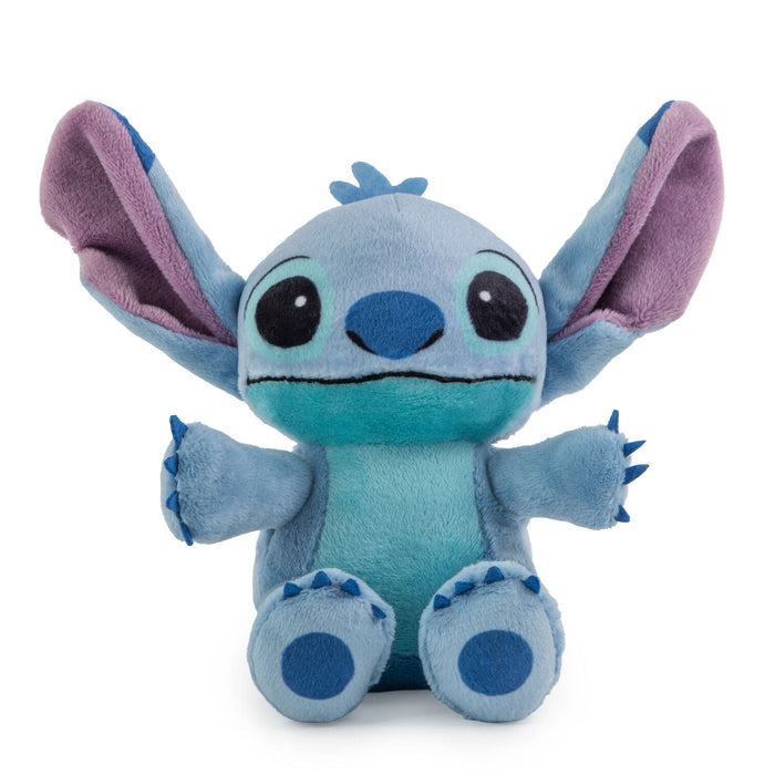 Plush toy resembling a character with a blue body and purple ears on a white background
