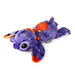 A Stitch plush toy lying down on a white background, decorated with a purple and orange Halloween pattern featuring spiderwebs, bats, stars, and bats.