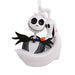 Skeleton character with a bow tie and orange pumpkin on a white background