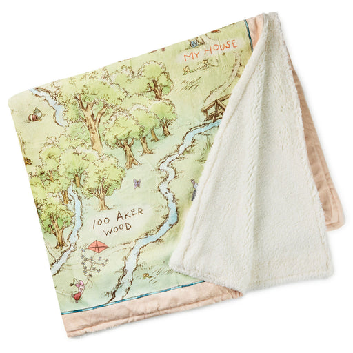 Map-themed blanket with a forest design and text on a white background