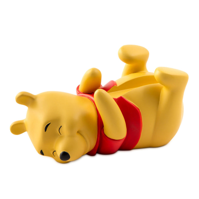 Yellow dog-shaped pillow with red collar on a white background