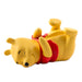 Yellow dog-shaped pillow with red collar on a white background