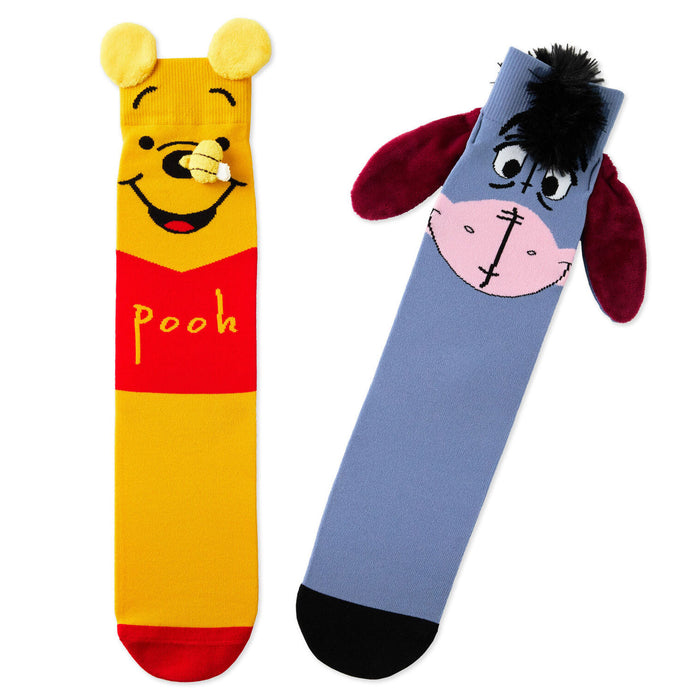 Two socks with cartoon character designs on a white background