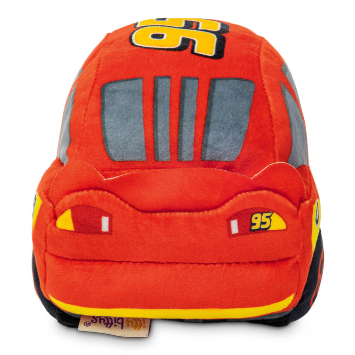 A plush toy shaped like a race car, featuring orange-red fabric, gray window panels, yellow and black number 95 details, and a small visible 'The Bruges' brand tag at the bottom.