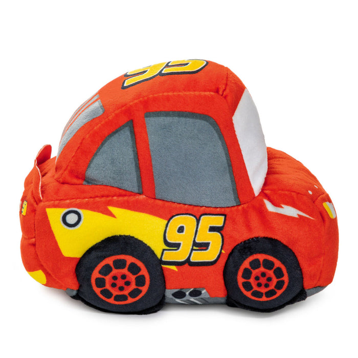 A plush toy car designed like a red race car with yellow number 95, gray windows, and black wheels, shown on a plain white background.