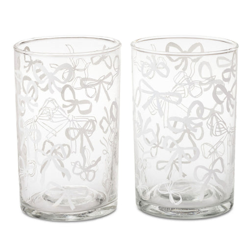 Two clear glass tumblers with etched bow patterns, shown side-by-side on a white background.