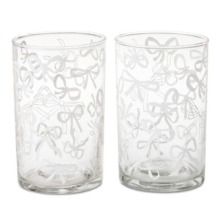 Two clear glass tumblers with etched bow patterns, shown side-by-side on a white background.
