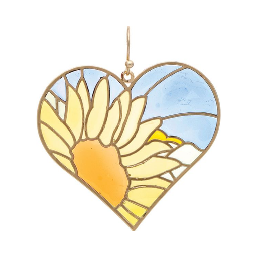 Heart-shaped stained glass sun catcher with a sun design on a white background