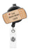 Retractable badge holder with bandage design and 'The Boo Boo Crew' text on a white background