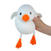 White duck-shaped toy with orange feet and beak, held by a hand on a white background