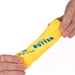 A person's hands stretching a yellow novelty prop shaped like a butter stick, printed with the words 'SALTED BUTTER' and '4 OZ NET WT. (113 G)' in blue text, against a plain white background.