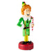Elf figurine holding a candy cane on a white background