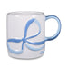 White mug with a blue bow design on a white background