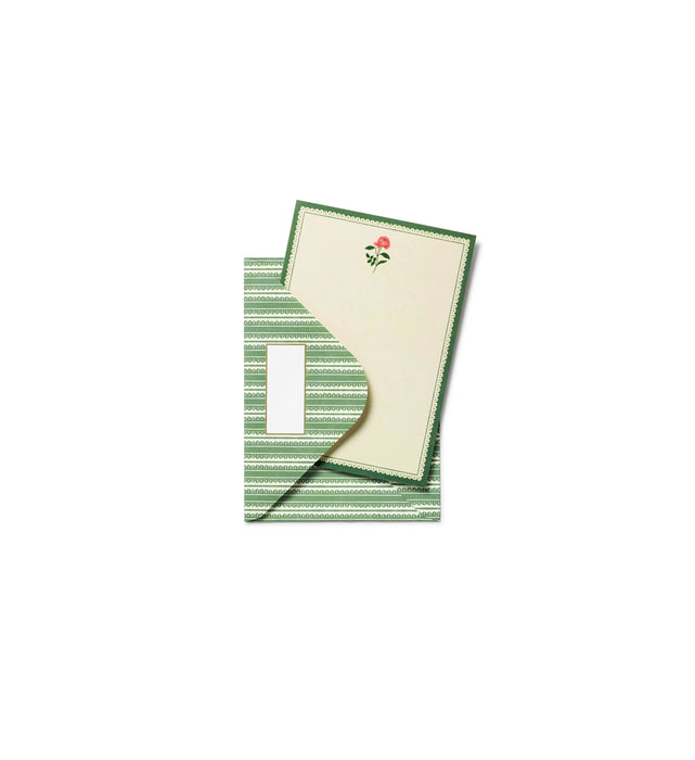 Green striped napkin with a white center featuring a red rose design on a white background