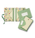 Set of stationery items with floral and geometric designs on a white background
