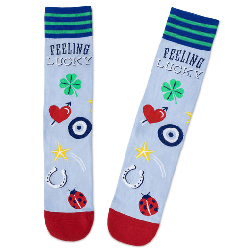 Two socks with 'Feeling Lucky' text and various symbols on a light blue background.