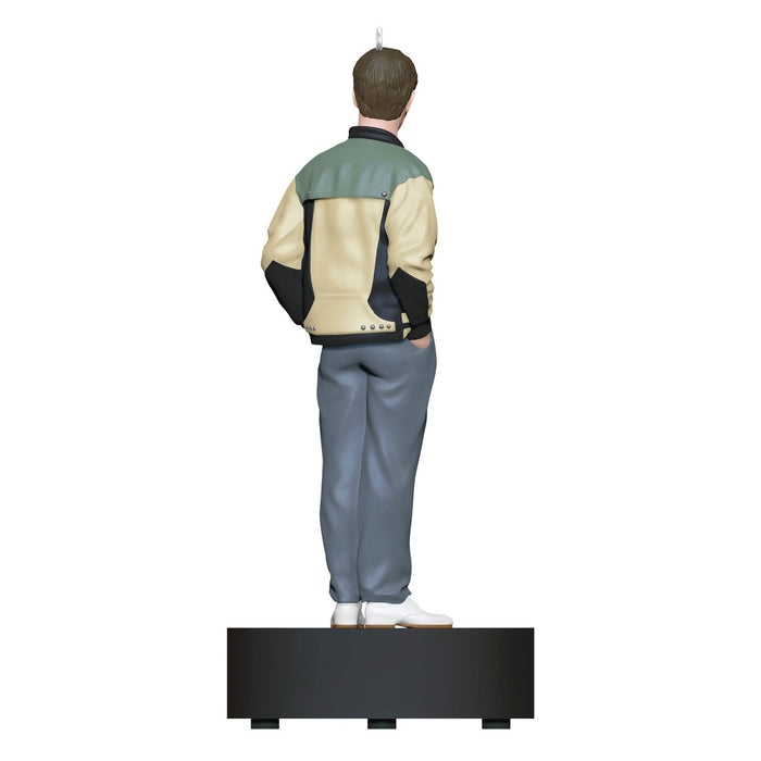 Statue of a person wearing a jacket and pants on a white background
