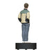 Statue of a person wearing a jacket and pants on a white background