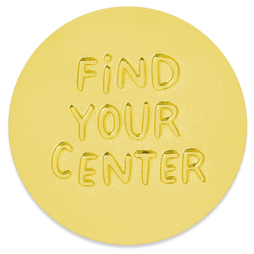 A round yellow mat or rug with the words 'FIND YOUR CENTER' embossed in the center, shown on a plain white background.