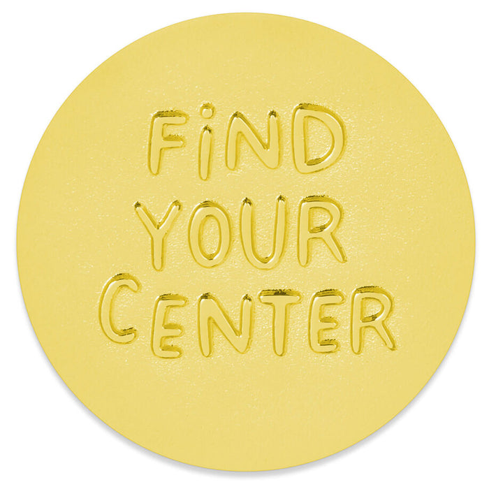 A round yellow mat or rug with the words 'FIND YOUR CENTER' embossed in the center, shown on a plain white background.