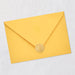 Yellow envelope with a gold seal on a light gray background