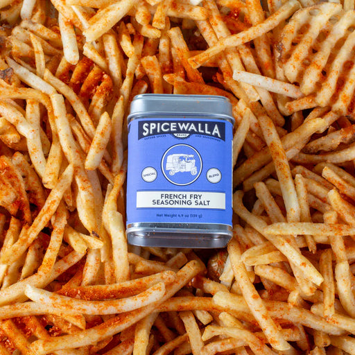 Spicewalla French Fry Seasoning Salt can on top of wavy fries