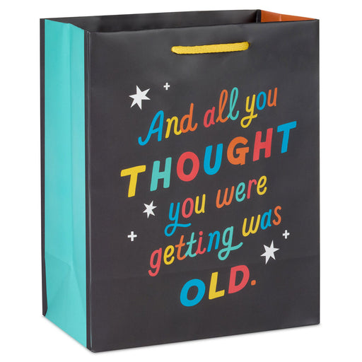 Gift bag with colorful text and stars on a black background