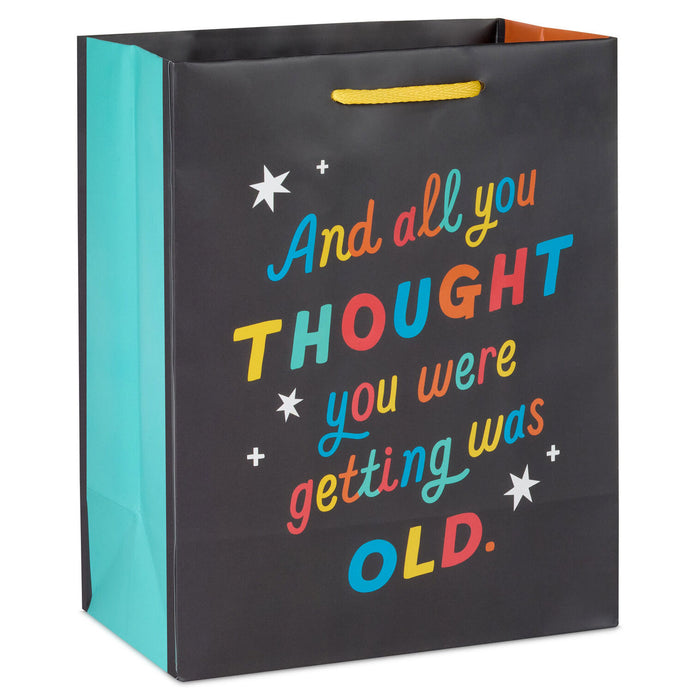 Gift bag with colorful text and stars on a black background