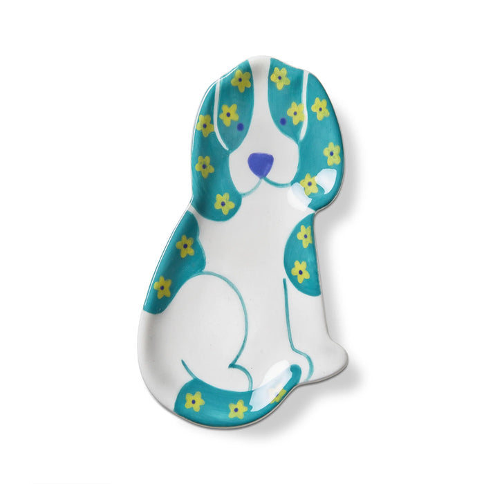 Decorative dog-shaped plate with floral patterns on a white background