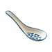 Ceramic spoon rest with blue geometric pattern on a white background