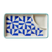 Ceramic dish with blue geometric pattern on a white background